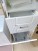 Шкаф-пенал Misty Эльбрус 40 с 1 ящиком, бельевой корзиной, правый, белая эмаль